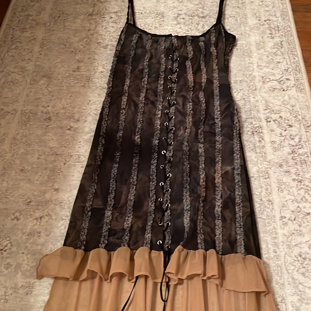 Very sexy sheer hi-low lace up dress.  Spaghetti straps. Size medium.